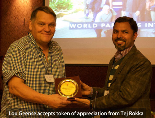 Lou Geense accepts token of appreciation from Tej Rokka Lou Geense, Tej Rokka