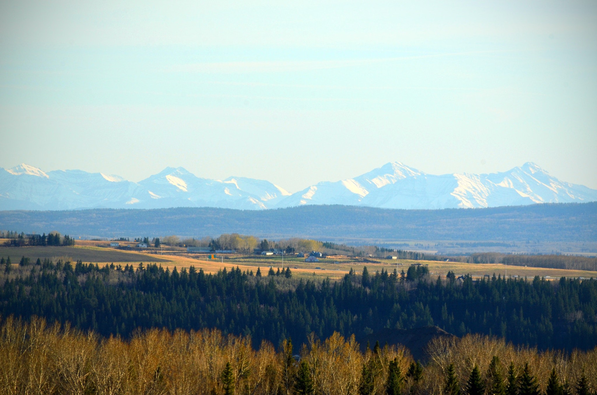 wide shot of the rocky mountains, taken from the windows of Centre Street Church Bearspaw Campus in Calgary Alberta